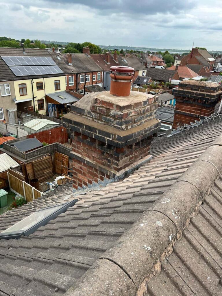 This is a photo taken from a roof which is being repaired by Bexleyheath Roofing Repairs, it shows a street of houses, and their roofs